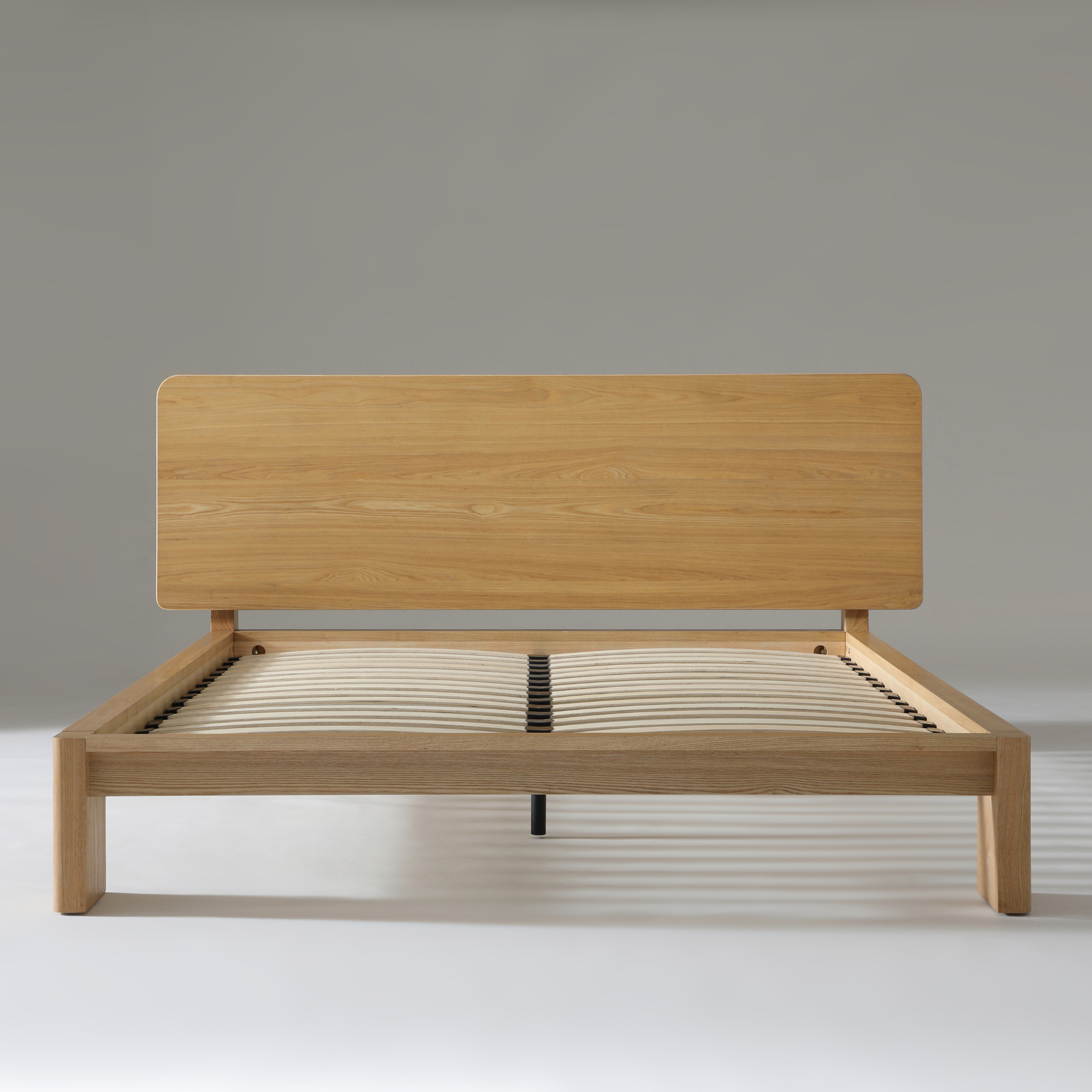 Xara Natural Ash Queen Size Bed featuring a sleek wooden frame and a modern design, perfect for any contemporary bedroom.