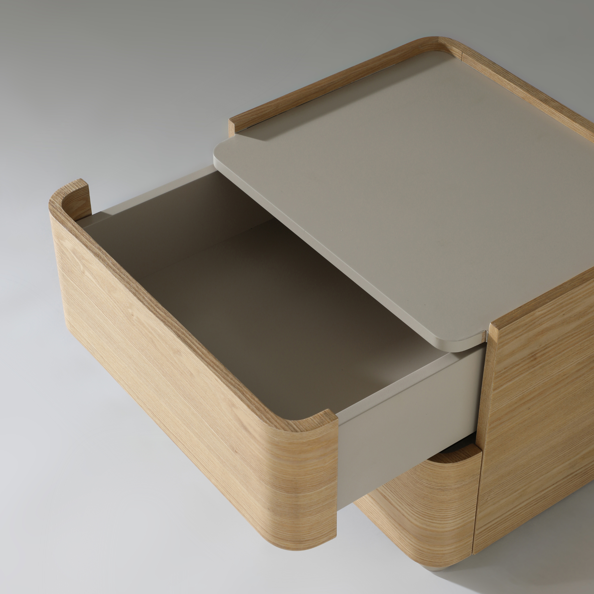 Xara 2 Drawer Bedside Table in natural ash with warm grey top and open drawer, showcasing sleek design and practical storage.