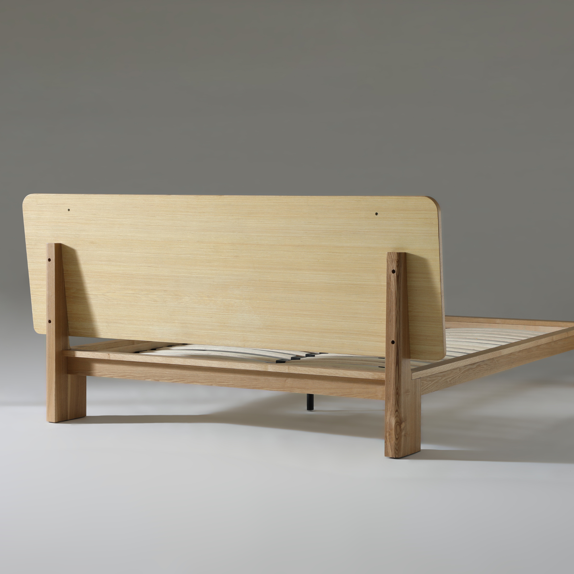 Xara natural ash queen size bed showcasing modern design and durable construction, highlighting the back view.