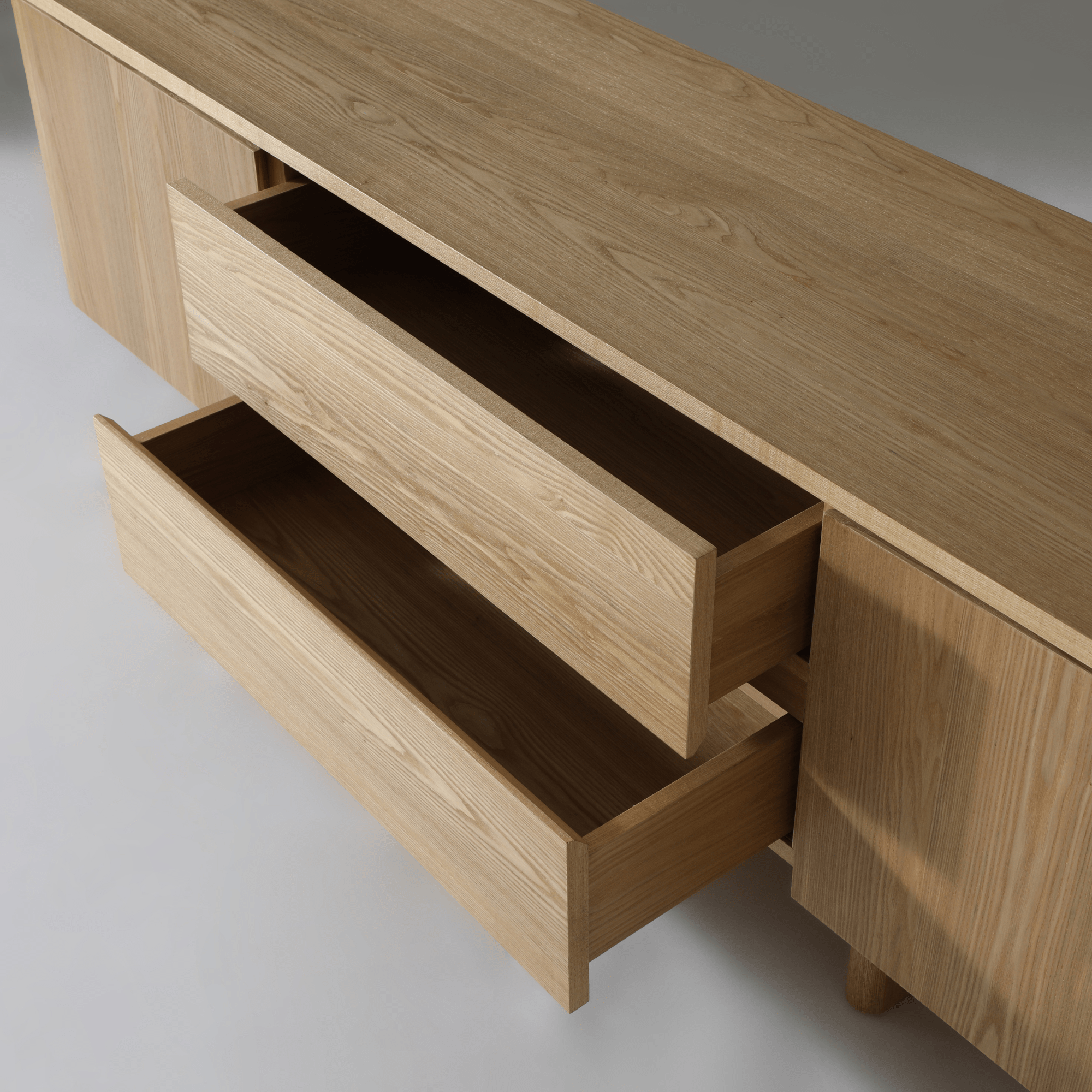 Kiama 1.8m 2 Door Entertainment Lowline in natural ash with open drawers showcasing storage space.