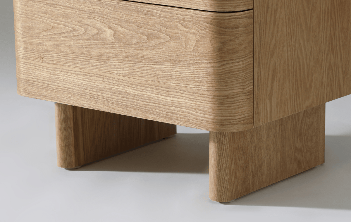 Close-up of Kiama 2 Drawer Bedside Table in natural ash showing smooth finish and modern leg design.