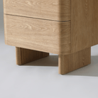 Close-up of Kiama 2 Drawer Bedside Table in natural ash showing smooth finish and modern leg design.