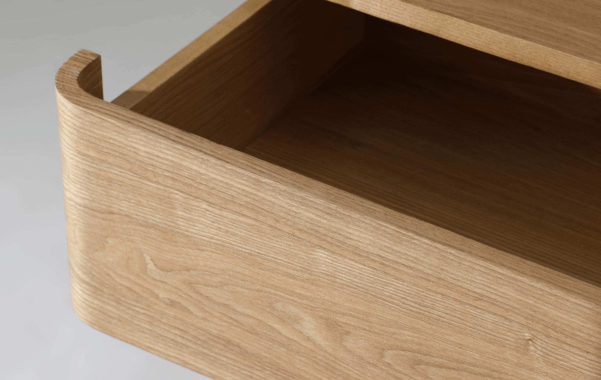 Kiama 2 Drawer Bedside Table in natural ash with an open drawer highlighting its smooth finish and spacious interior.