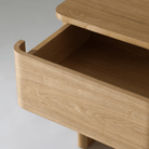 Kiama 2 Drawer Bedside Table in natural ash with an open drawer highlighting its smooth finish and spacious interior.