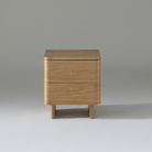 Kiama 2 Drawer bedside table in natural ash wood with smooth finish, ideal for practical bedroom storage.