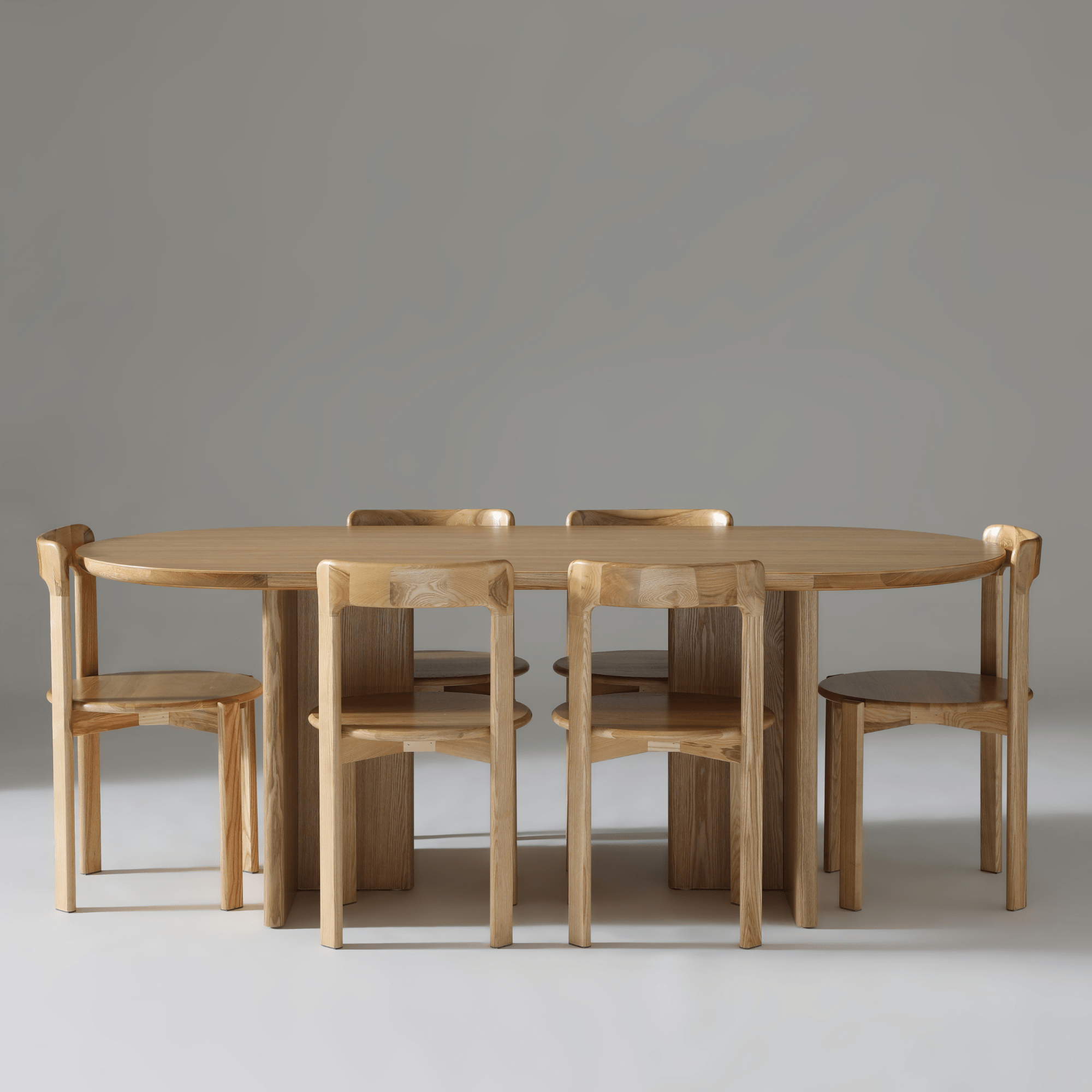 Kiama 2m Dining Table in Natural Ash with six matching chairs, showcasing modern design and elegant craftsmanship.