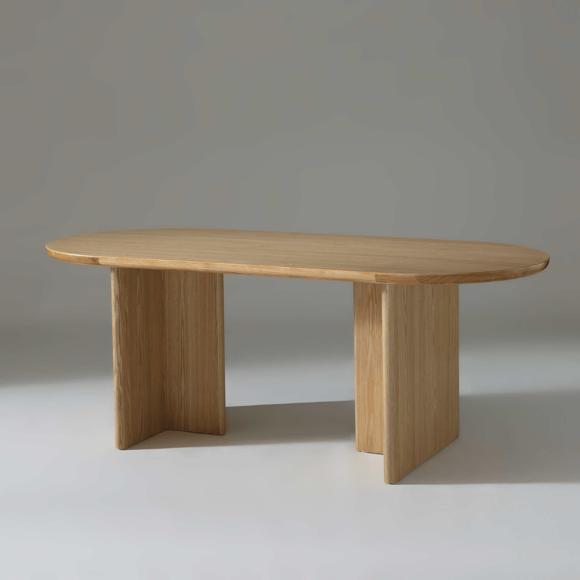 Kiama 2m Natural Ash Dining Table with soft curved edges, perfect for stylish dining and entertaining guests.