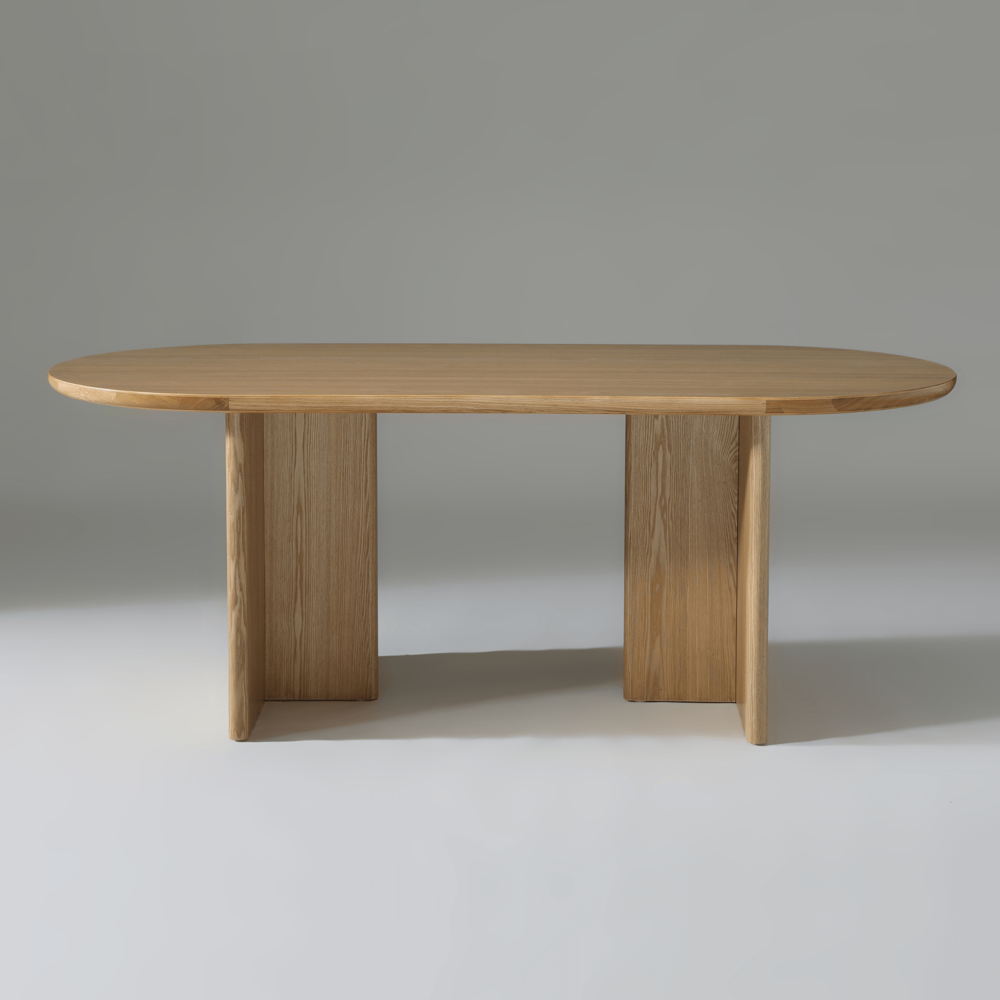 Kiama 2m Natural Ash Dining Table with soft curved edges, perfect for modern dining and entertaining.