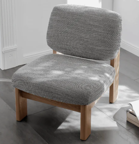 Mid Century Modern Armchairs, oak frame with bouclé upholstery in natural, paired with matching side table and neutral rug.