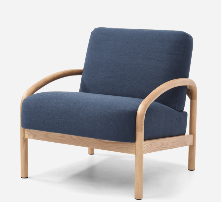 Mid Century Modern Armchairs, oak frame with bouclé upholstery in natural, paired with matching side table and neutral rug.