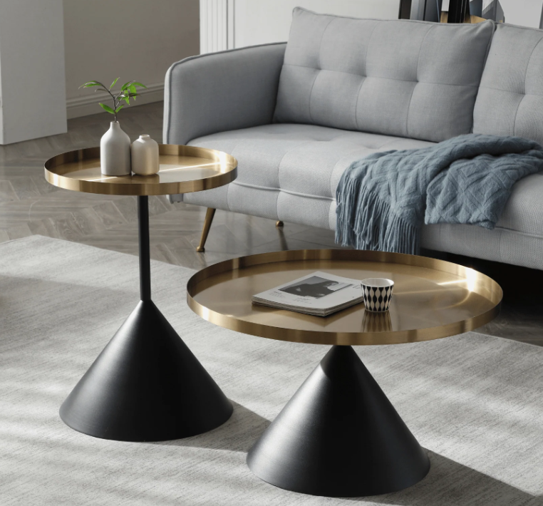 Mid century modern side table with fluted glass top, 48 cm round, gold frame, styled beside linen sofa.