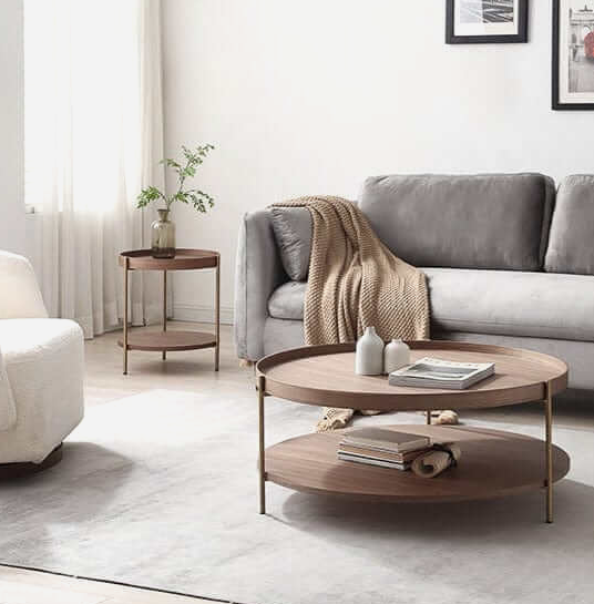 Rectangular 120 cm modern coastal coffee table in warm walnut, brushed steel frame, paired with linen sofa, neutral rug, rattan tray decor.