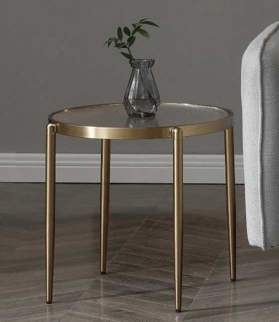 Modern gold side table styled with decorative accessories, showcasing how it enhances both practical use and timeless elegance.
