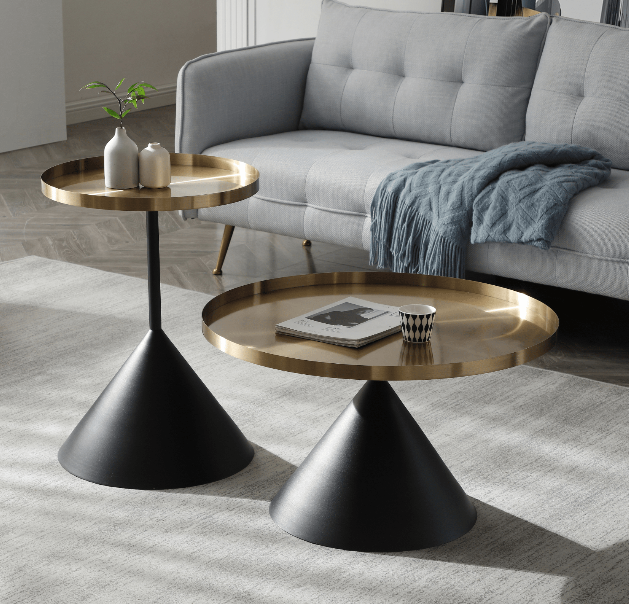 Set of two brushed gold side tables designed to add glamour and versatile functionality to any contemporary home interior.