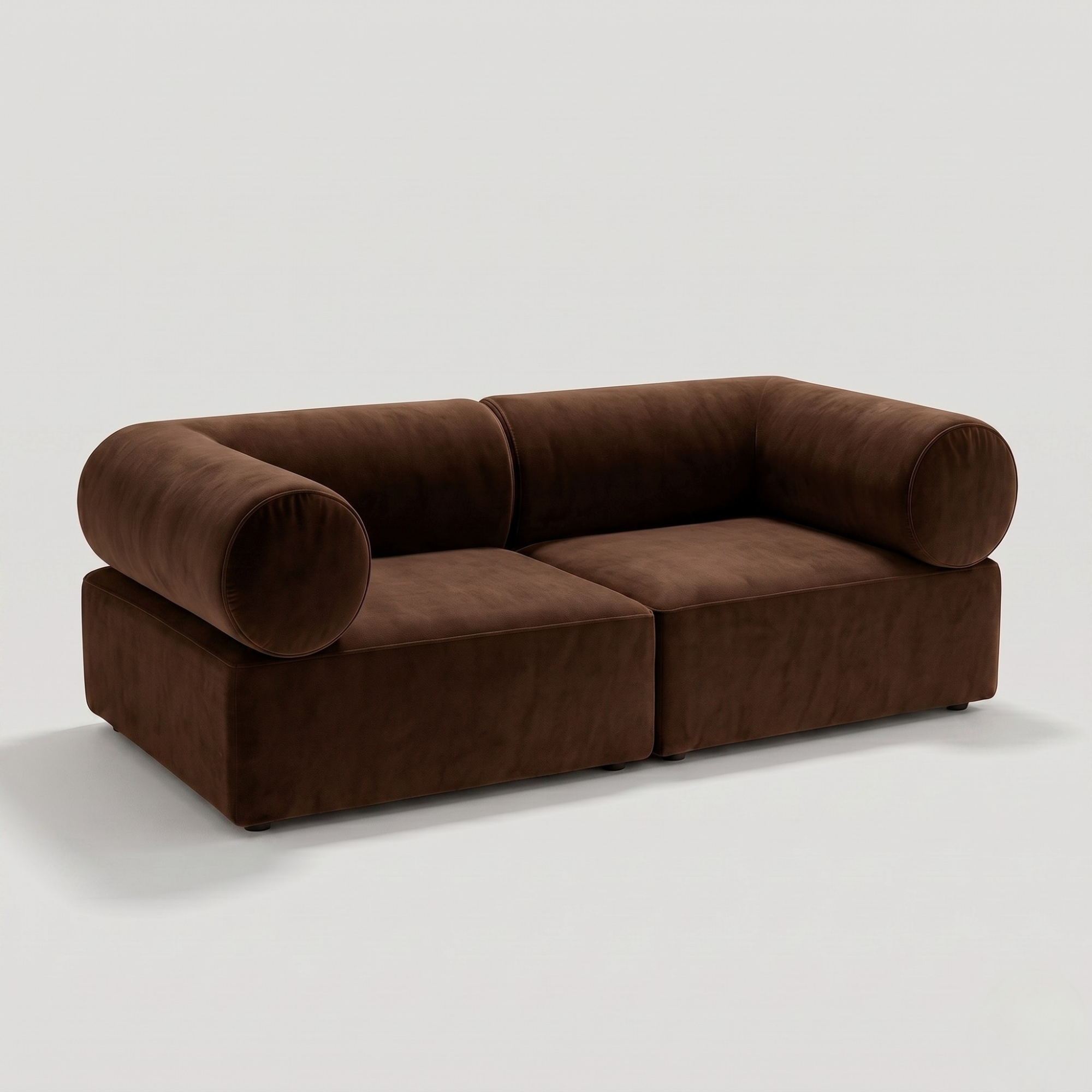 Brown leather sectional sofa with rounded armrests and plush cushions, set against a plain white background for modern living room decor