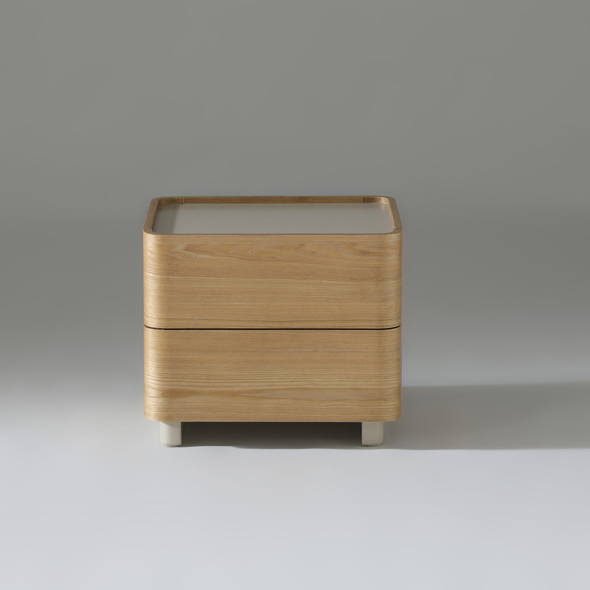Xara 2 drawer bedside table in natural ash with warm grey finish, featuring spacious drawers and minimalist design.