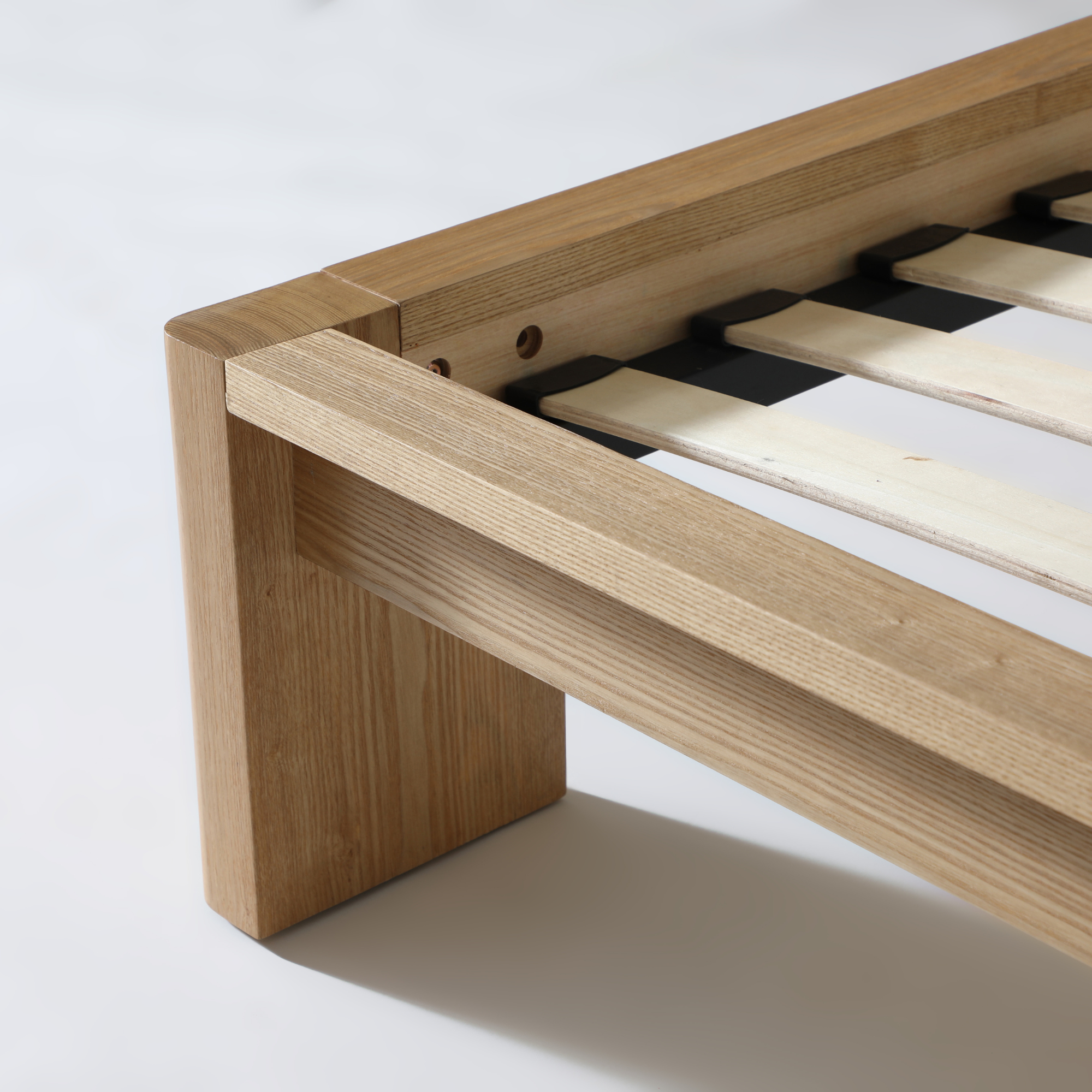 Close-up of Xara natural ash queen size bed frame showcasing durable construction and modern design.