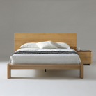 Xara Natural Ash Queen Size Bed featuring modern coastal design with durable construction and stylish bedding.
