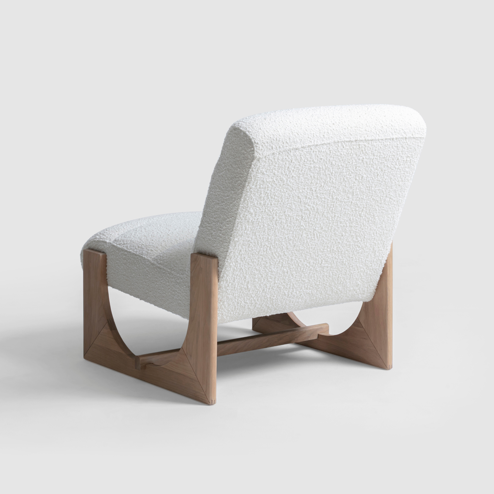Elegant Oscar Lounge Chair with textured natural boucle fabric and oak wood base.