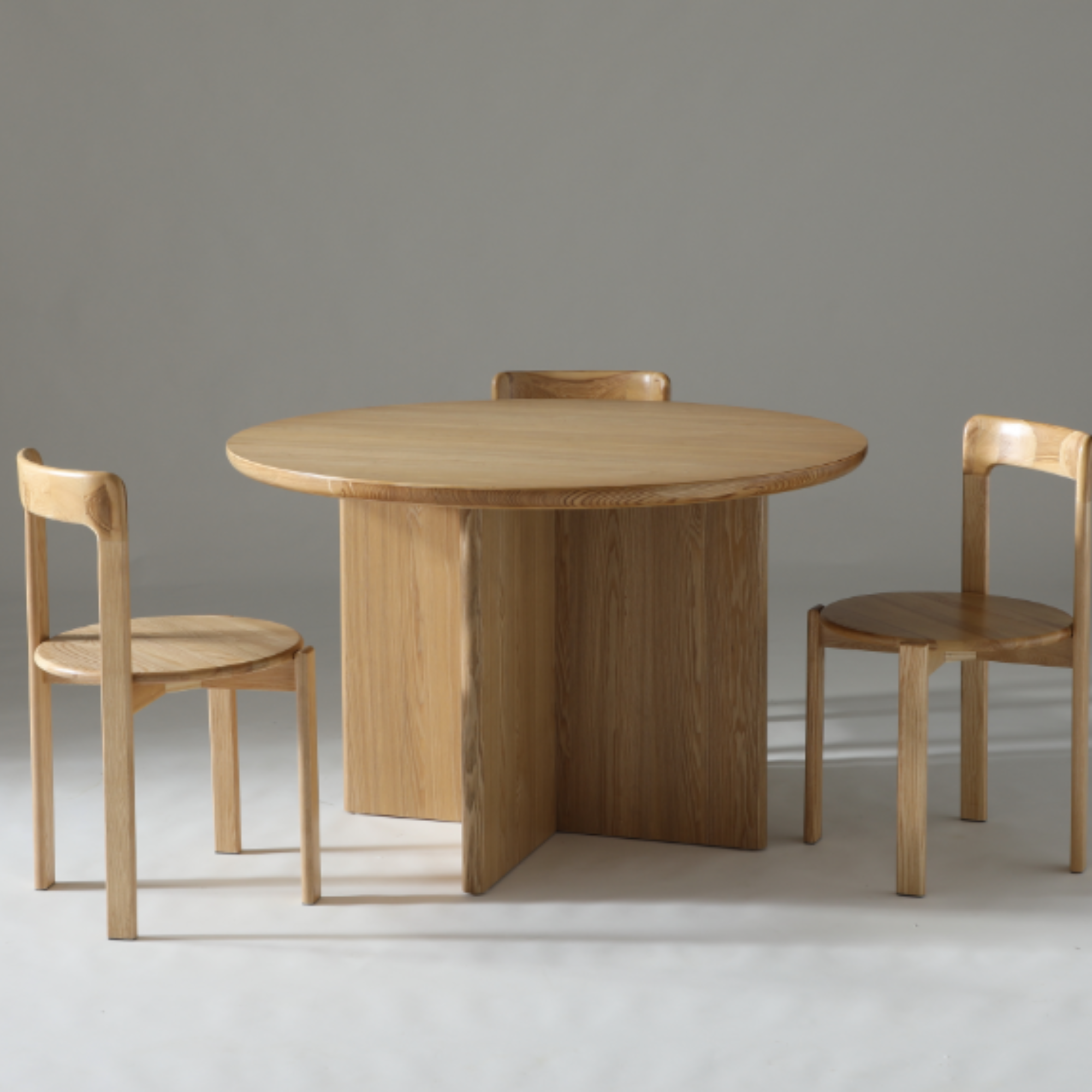 Kiama 1.2m round table with soft rounded edges and a sturdy ash veneer leg frame.