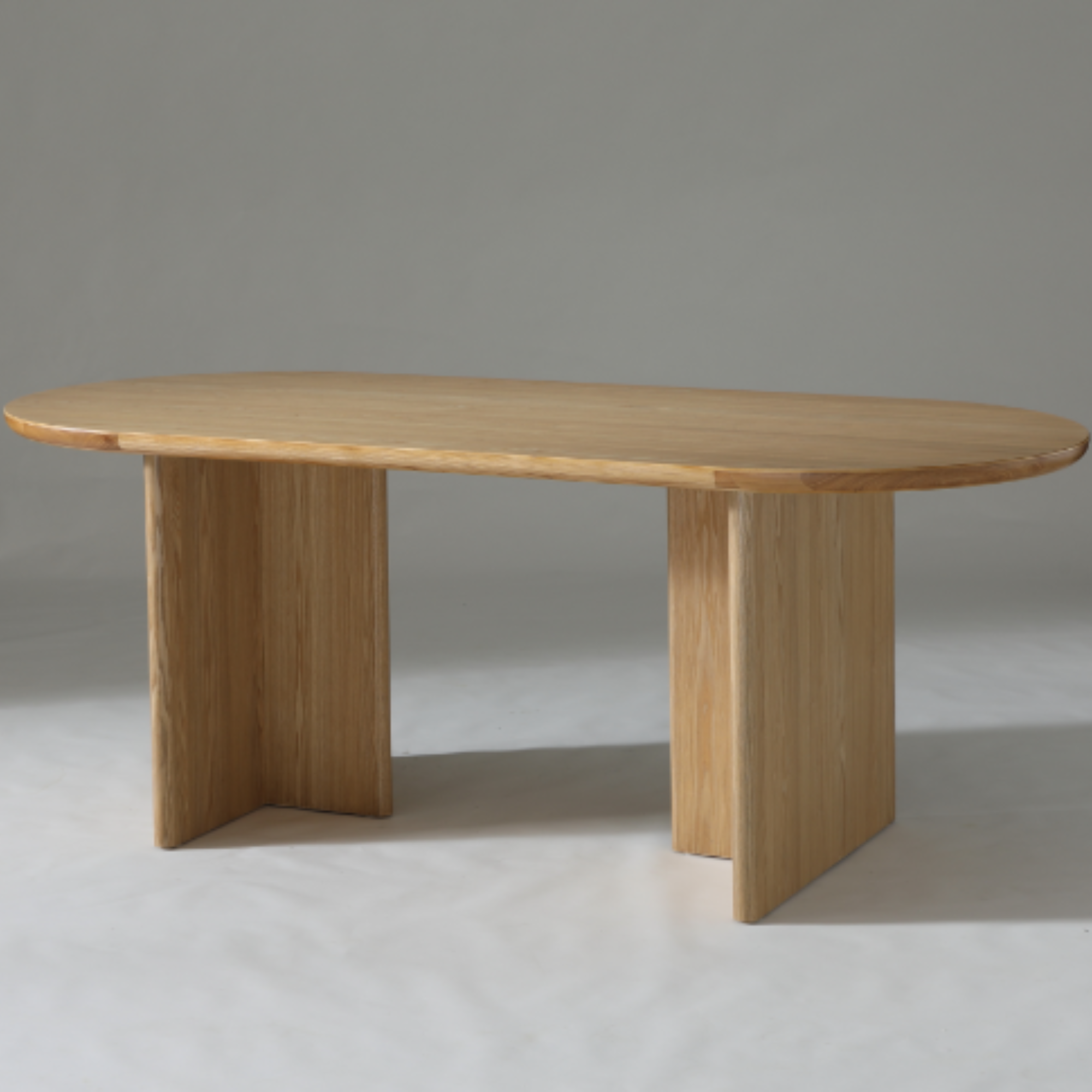 Kiama 1.6m Natural Ash Dining Table with soft curved edges and contemporary design, perfect for modern interiors.

