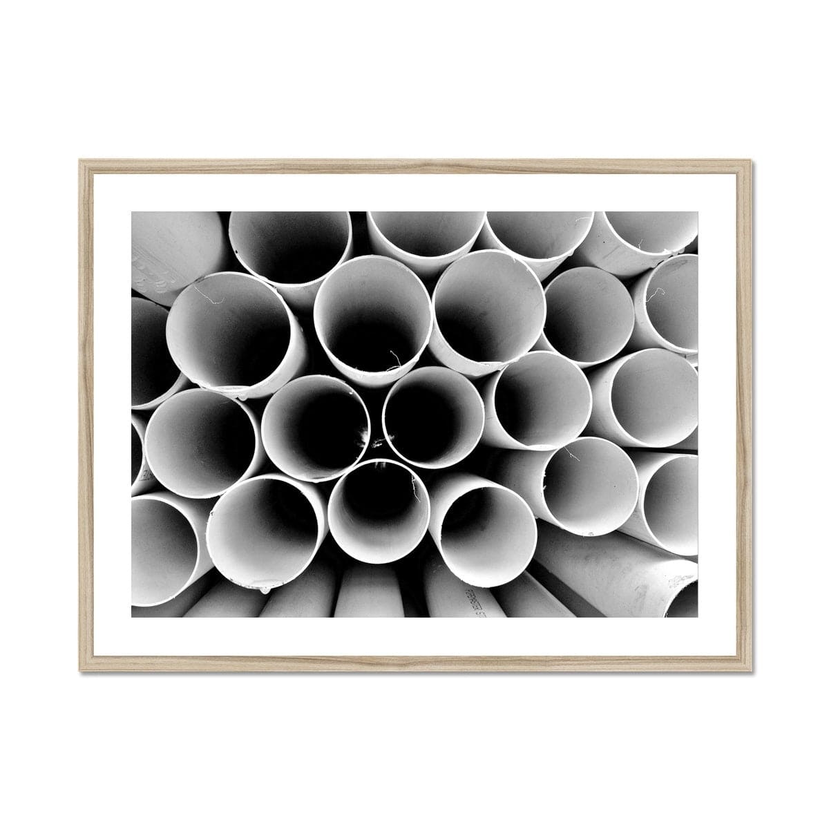 Seek & Ramble Framed A4 Landscape (29x21cm) / Natural Frame Monochrome Round Pipes Abstract Framed & Mounted Print